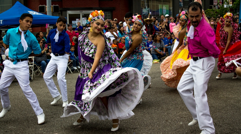 Latin dancers dancing in the street during a festival