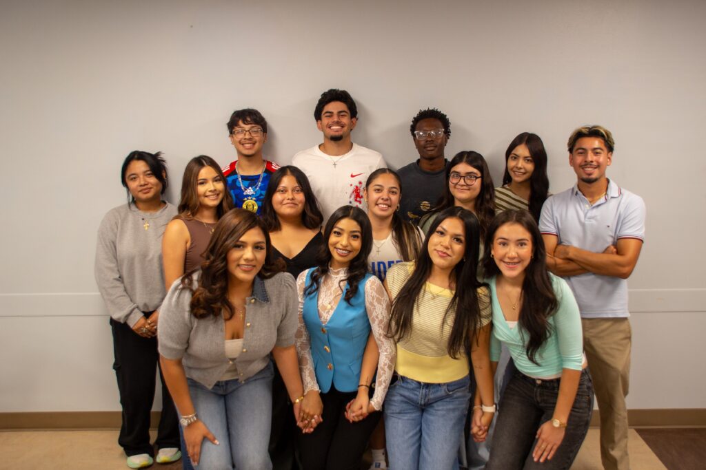 Group of Rose State College students posing together and smiling for a group photo.