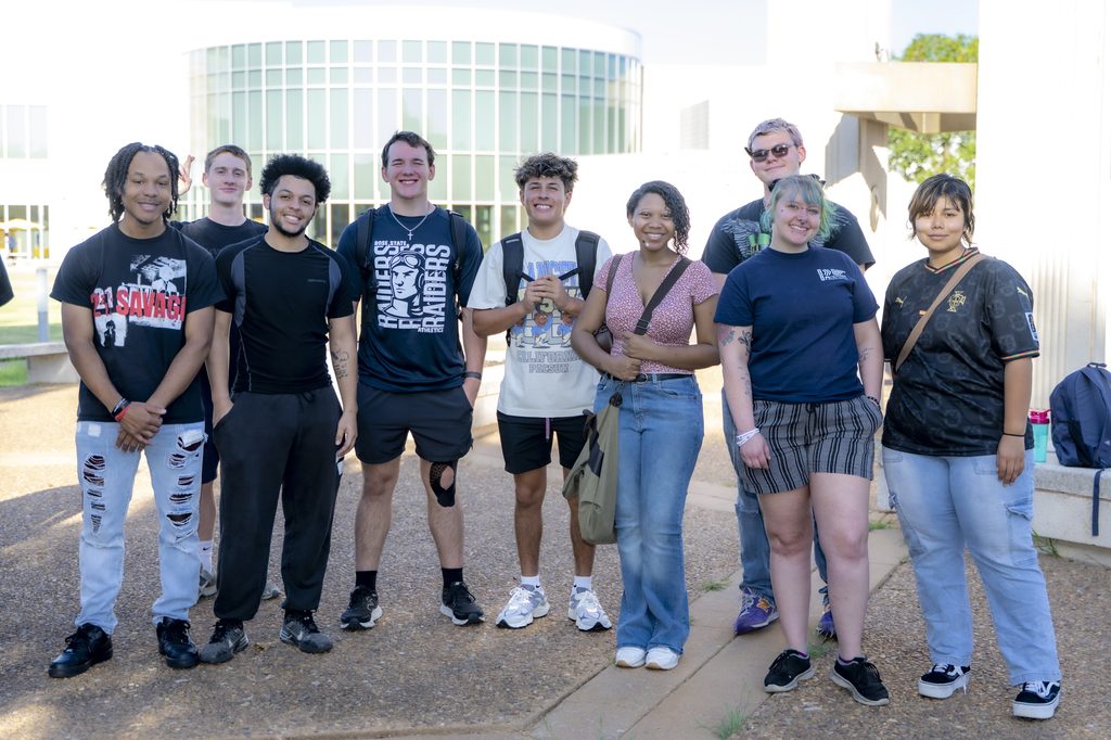 Group of Rose State College students smiling together outdoors on campus during Constitution Week.